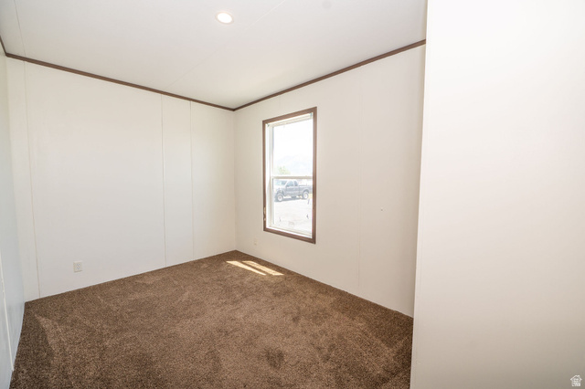 2491 Highway 89, Unit 403 Pleasant View, UT 84404 - Photo 30 of 32 Carpeted interior space with a single window and recessed ceiling lighting