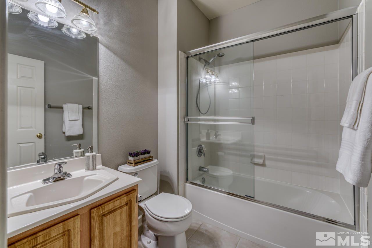 900 S, Unit 2024 Reno, NV 89521 - Photo 24 of 32 a bathroom with a sink toilet and shower