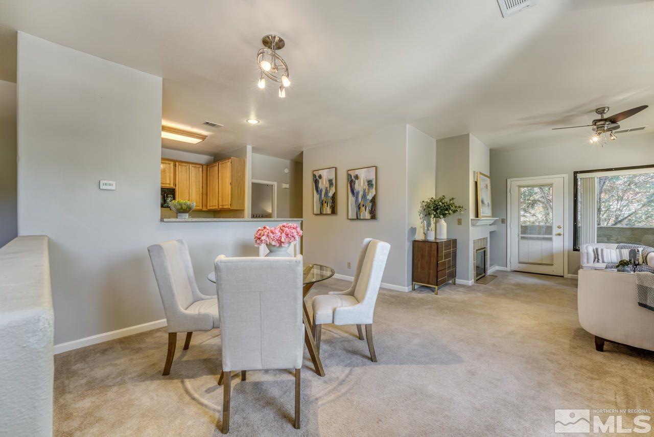 900 S, Unit 2024 Reno, NV 89521 - Photo 5 of 32 a view of a dining room with furniture and a livingroom