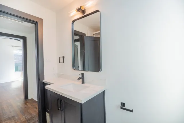 a bathroom with a sink and a mirror