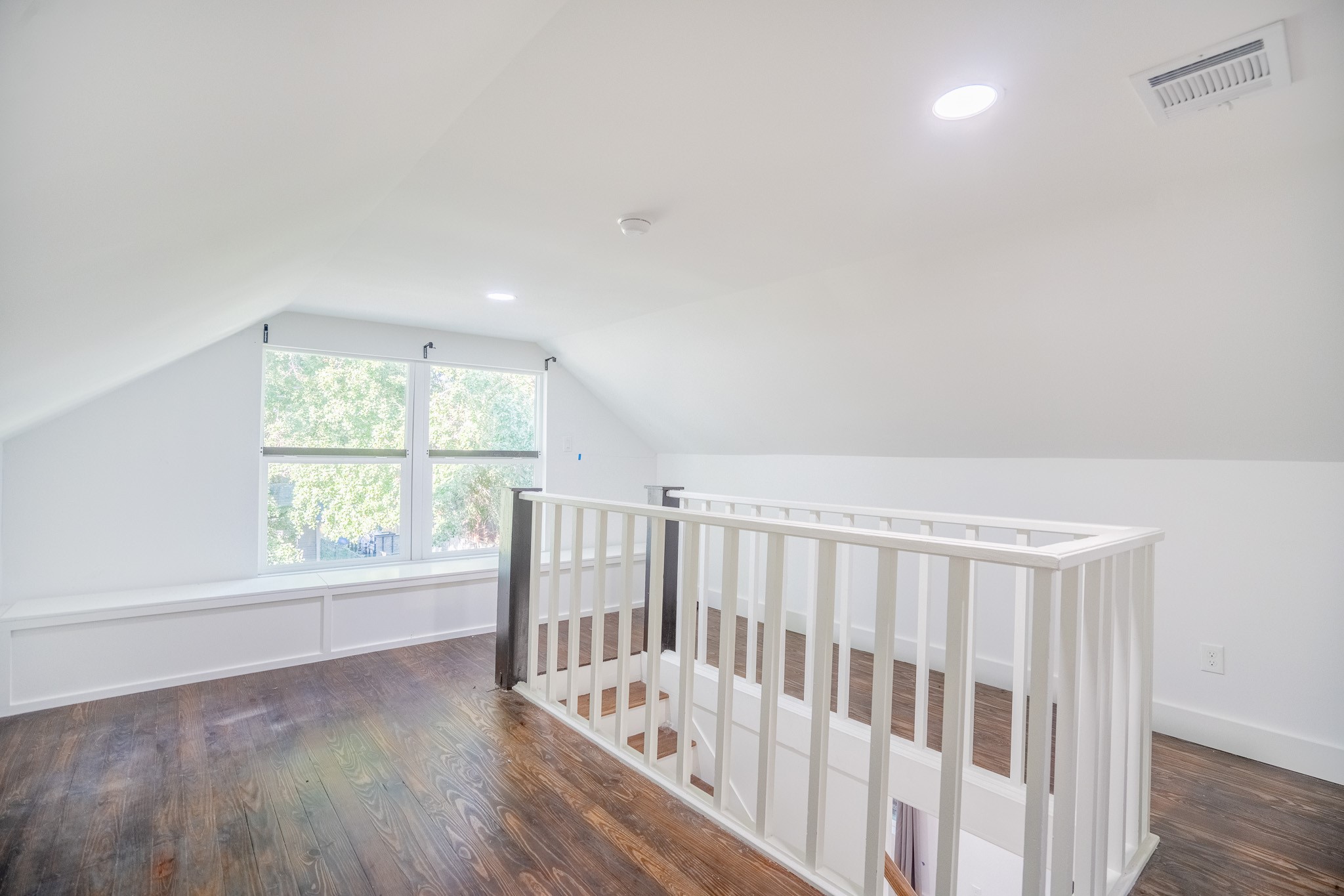 7305 Capitol Street Houston, TX 77011 - Photo 14 of 16 a view of hallway with stairs and wooden floor