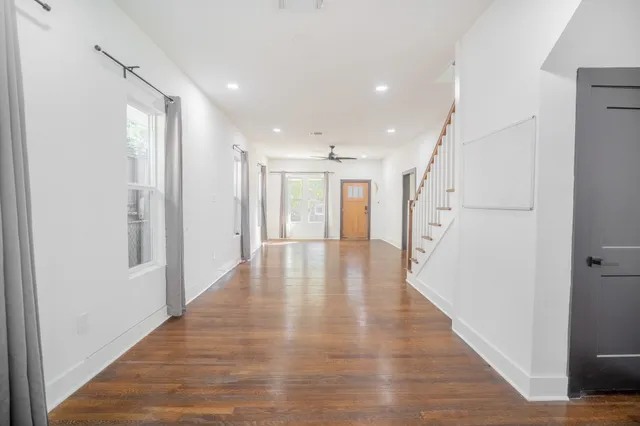 a view of an entryway with wooden floor