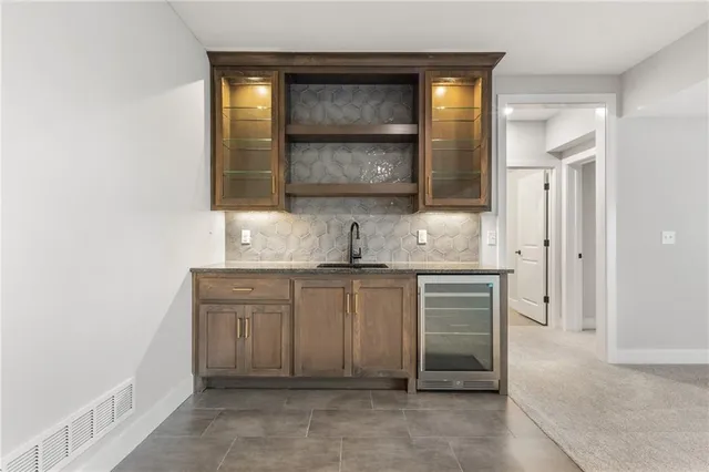 $590,000 | 1128 Southwest Whitby Drive, Lee's Summit, MO 64083