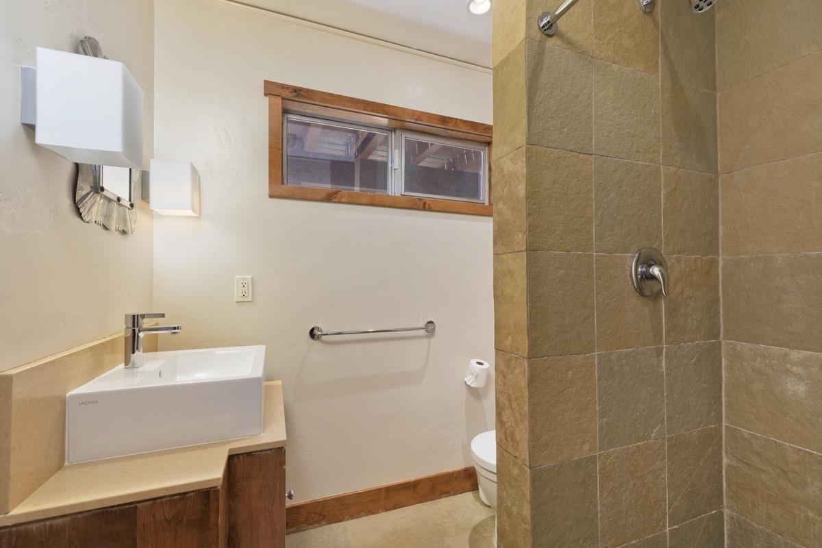 210 Convict Drive Mammoth Lakes, CA 93546 - Photo 12 of 46 a bathroom with a sink and a mirror