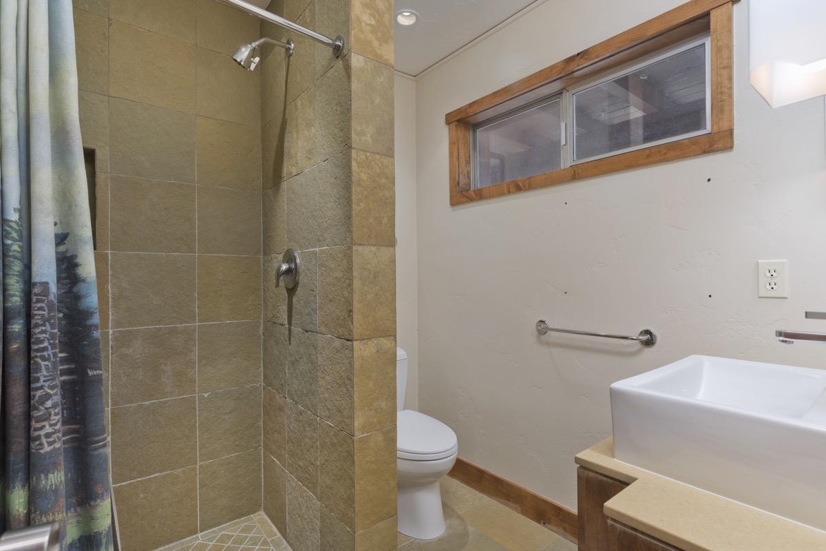 210 Convict Drive Mammoth Lakes, CA 93546 - Photo 17 of 46 a bathroom with a toilet and a shower