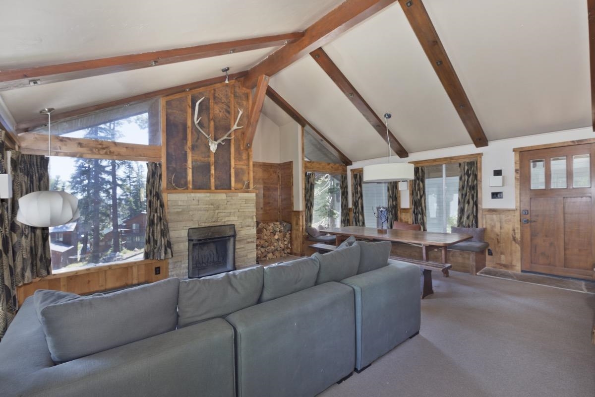 210 Convict Drive Mammoth Lakes, CA 93546 - Photo 18 of 46 a living room with furniture and a fireplace