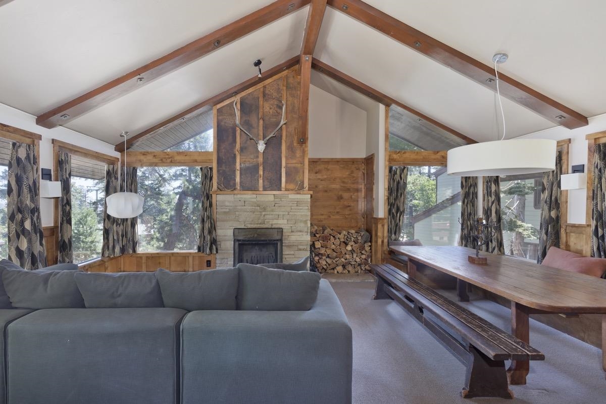210 Convict Drive Mammoth Lakes, CA 93546 - Photo 19 of 46 a living room with furniture and a fireplace