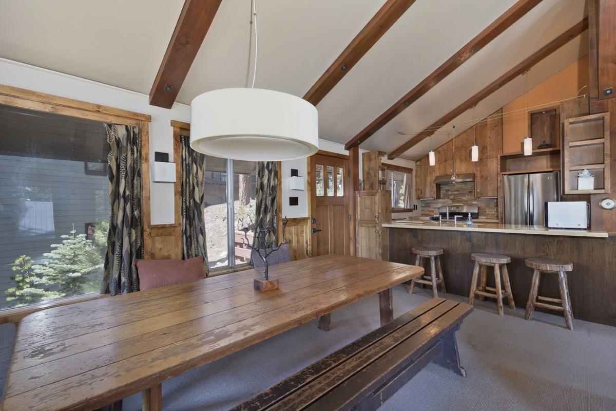 210 Convict Drive Mammoth Lakes, CA 93546 - Photo 23 of 46 a dining hall with couches and wooden floor