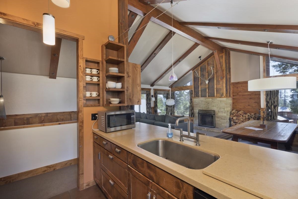 210 Convict Drive Mammoth Lakes, CA 93546 - Photo 30 of 46 a kitchen with a sink and a refrigerator