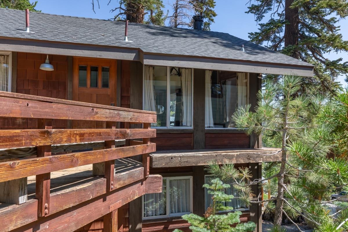 210 Convict Drive Mammoth Lakes, CA 93546 - Photo 35 of 46 a view of a house with a window and wooden fence