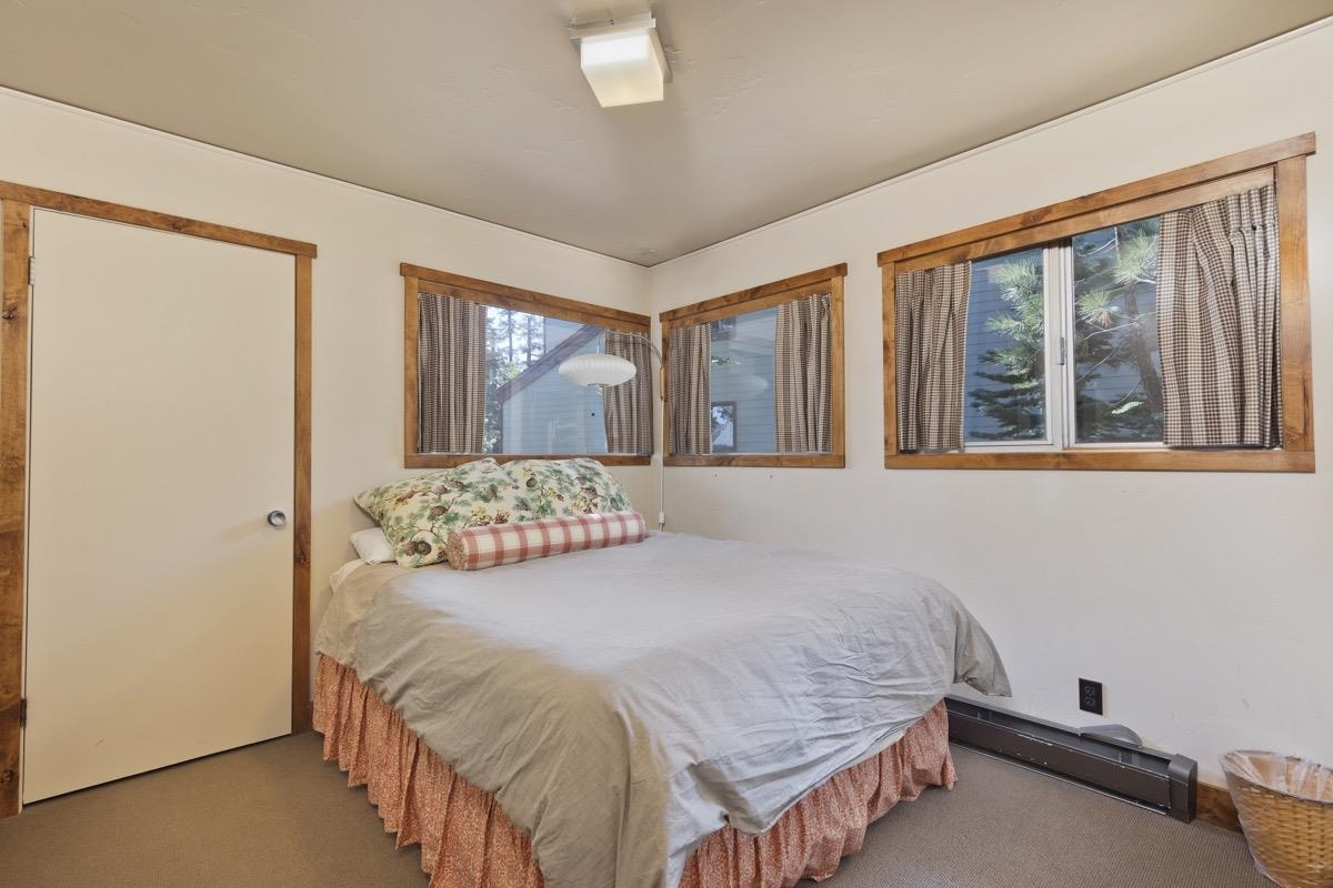 210 Convict Drive Mammoth Lakes, CA 93546 - Photo 10 of 46 a bedroom with a bed and window