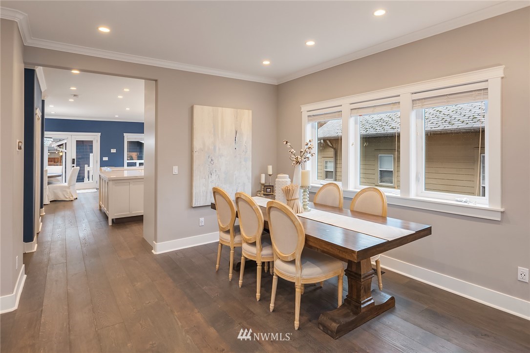 912 North 68th Street Seattle, WA 98103 - Photo 8 of 38 a view of a dining room with furniture and wooden floor