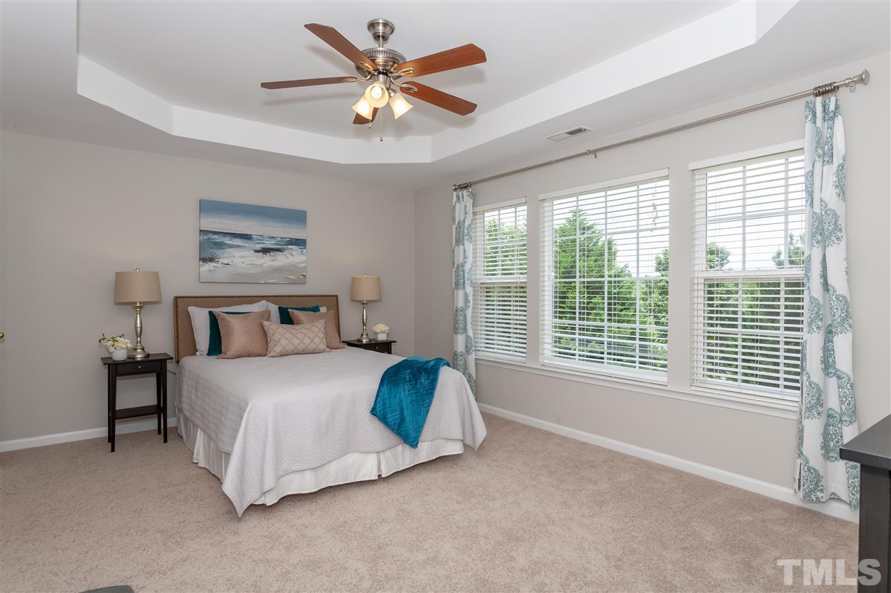 7331 Brandon Allen Avenue Raleigh, NC 27613 - Photo 11 of 25 The master suite is HUGE and can easily accomodate a king-sized bed, bench, and oversized furniture. Tray ceiling adds architectural interest to this great space.
