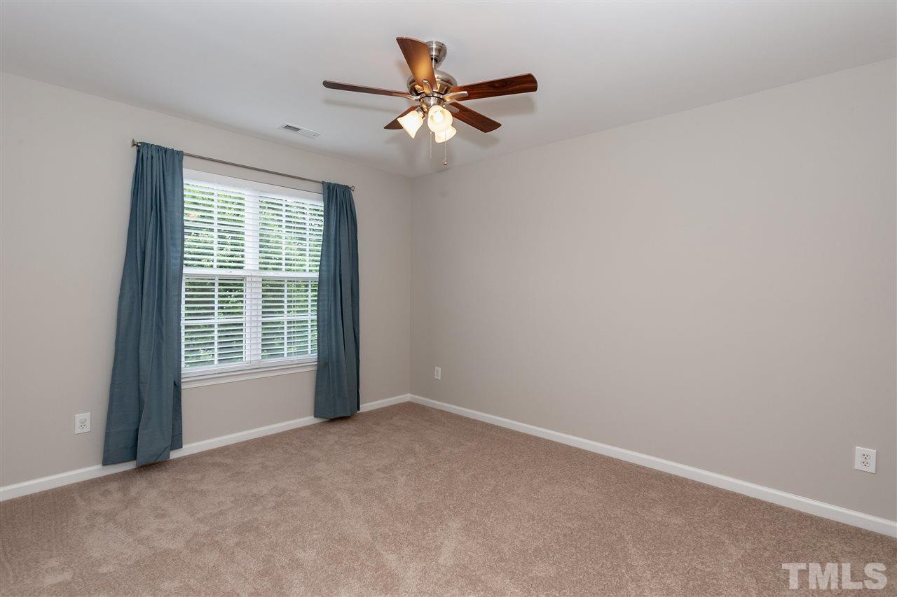 7331 Brandon Allen Avenue Raleigh, NC 27613 - Photo 13 of 25 Bedroom directly across from master is generously-sized and has ample closet space.