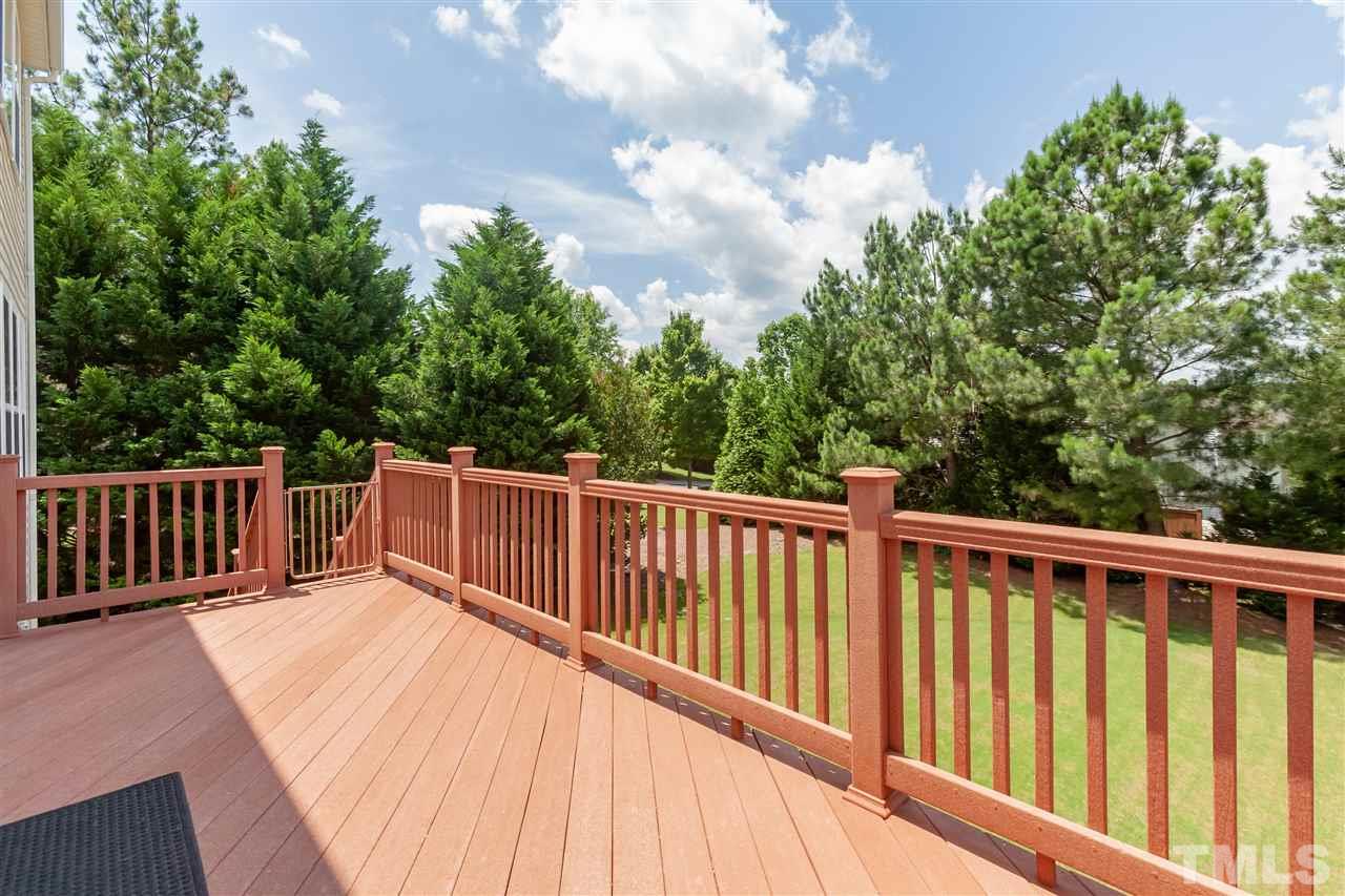 7331 Brandon Allen Avenue Raleigh, NC 27613 - Photo 21 of 25 The large, flat lot lives even larger since it's next to two HOA-owned buffers. Enjoy the peaceful view from the large Trex-covered low maintenance deck.