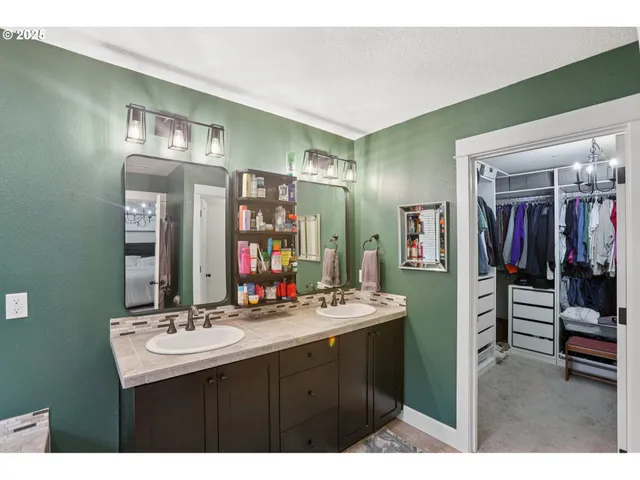 a bathroom with a sink vanity and a mirror