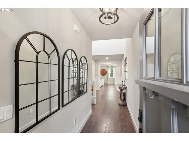 a view of an entryway with wooden floor
