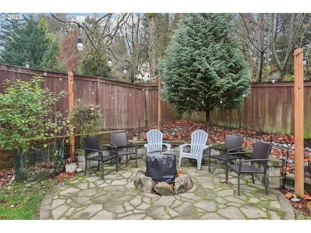 a backyard of a house with outdoor seating