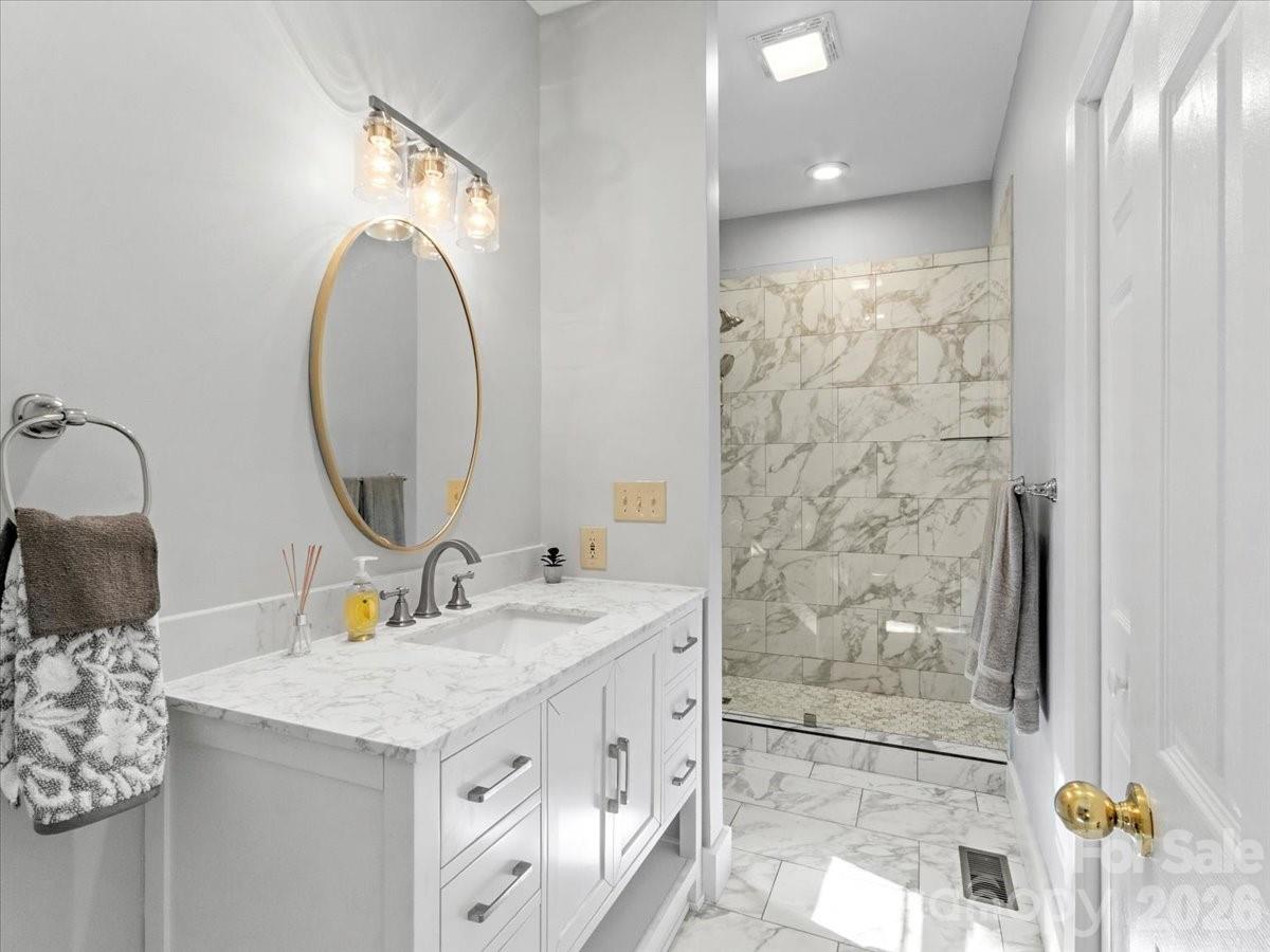 140 Slickrock Road, Unit F4 Burnsville, NC 28714 - Photo 28 of 41 a bathroom with a sink double vanity and a mirror