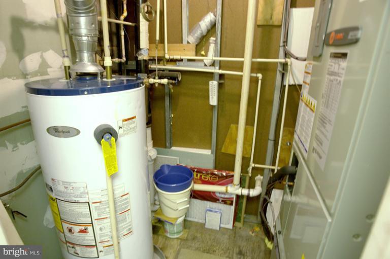 7530 Brink Road Gaithersburg, MD 20882 - Photo 2 of 30 Utility closet has a propane gas hot water heater.