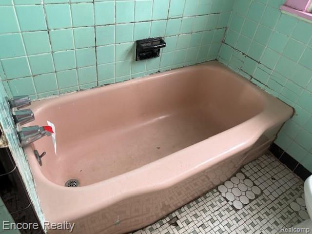 19300 Berg Road Detroit, MI 48219 - Photo 10 of 28 Full bathroom featuring tile patterned flooring and a bath