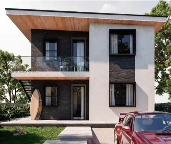 a view of a house with a porch and furniture