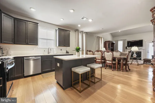 a kitchen with lots of counter top space and living room