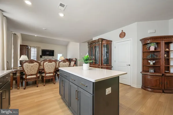 a room with furniture a clock and a view