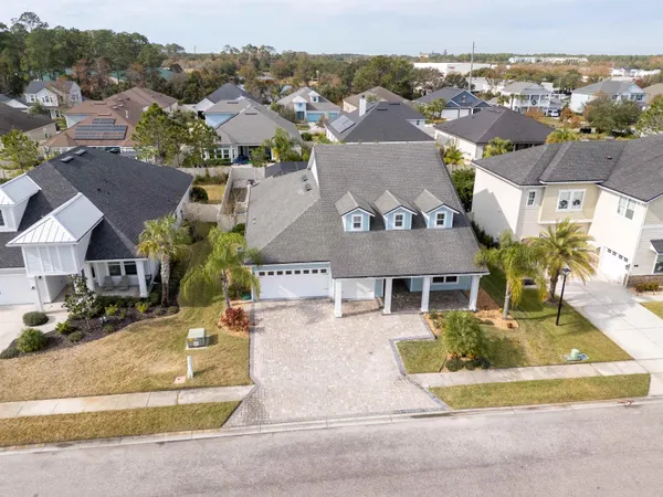 an aerial view of a house with outdoor space