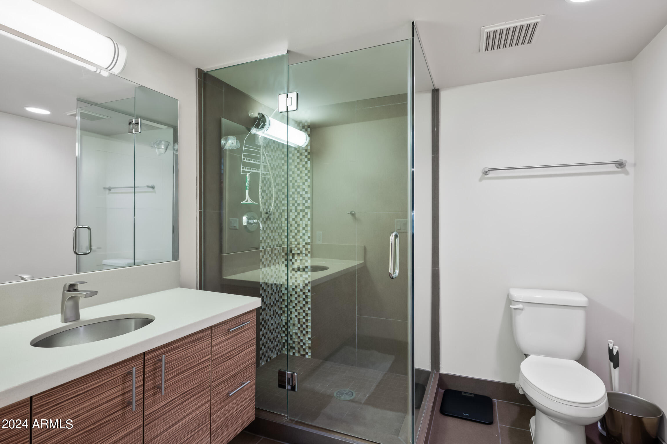 535 West Thomas Road, Unit 212 Phoenix, AZ 85013 - Photo 10 of 18 a bathroom with a sink toilet and shower