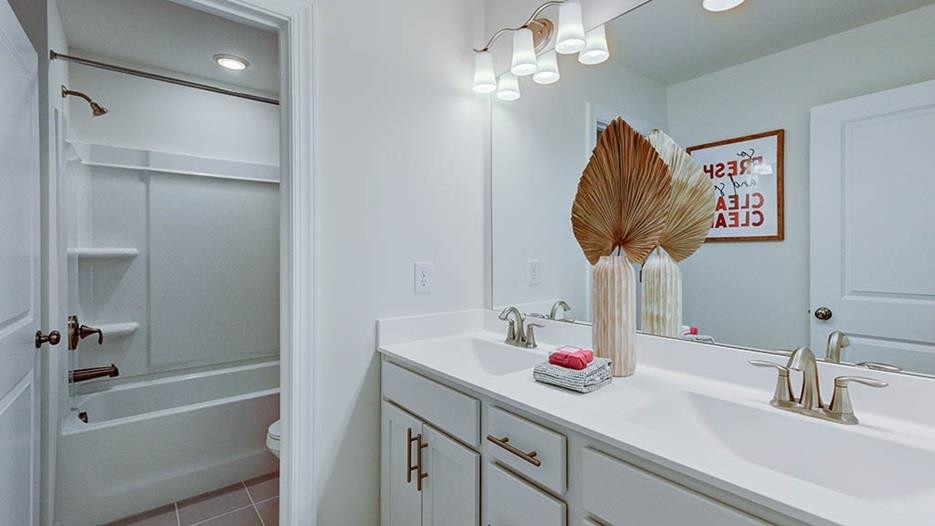 941 Baldwin Rdg Road Apex, NC 27523 - Photo 18 of 21 a bathroom with a sink vanity tub and shower