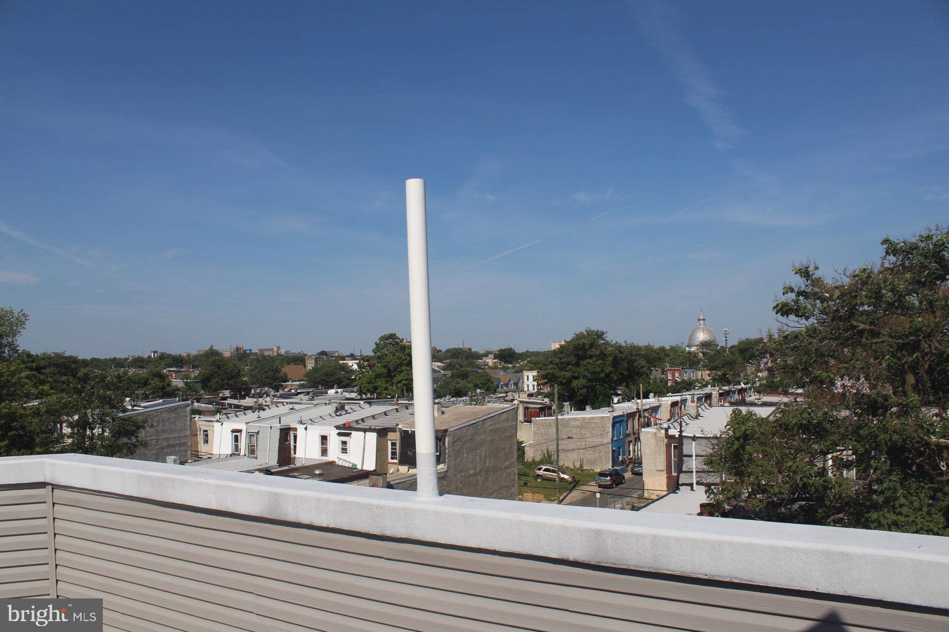 3017 Ridge Avenue, Unit C Philadelphia, PA 19121 - Photo 5 of 27 Urban skyline with a clear blue sky.