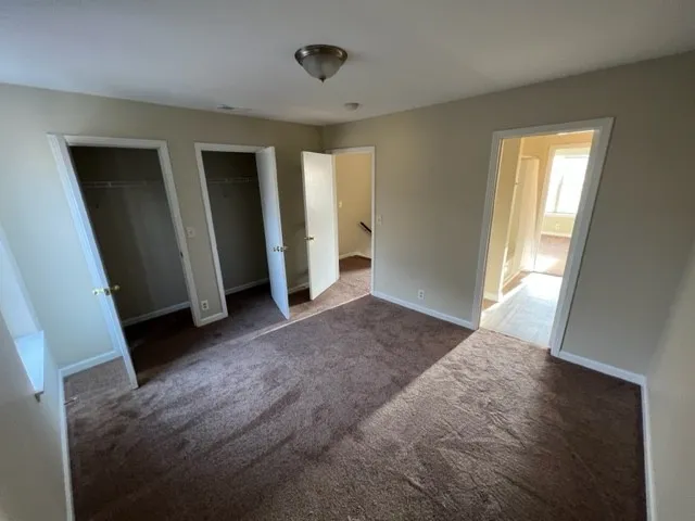 a view of entryway with window and stairs