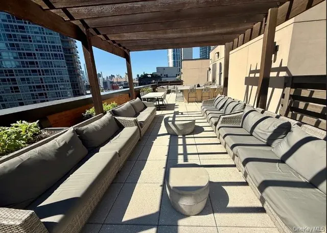 a view of balcony with furniture