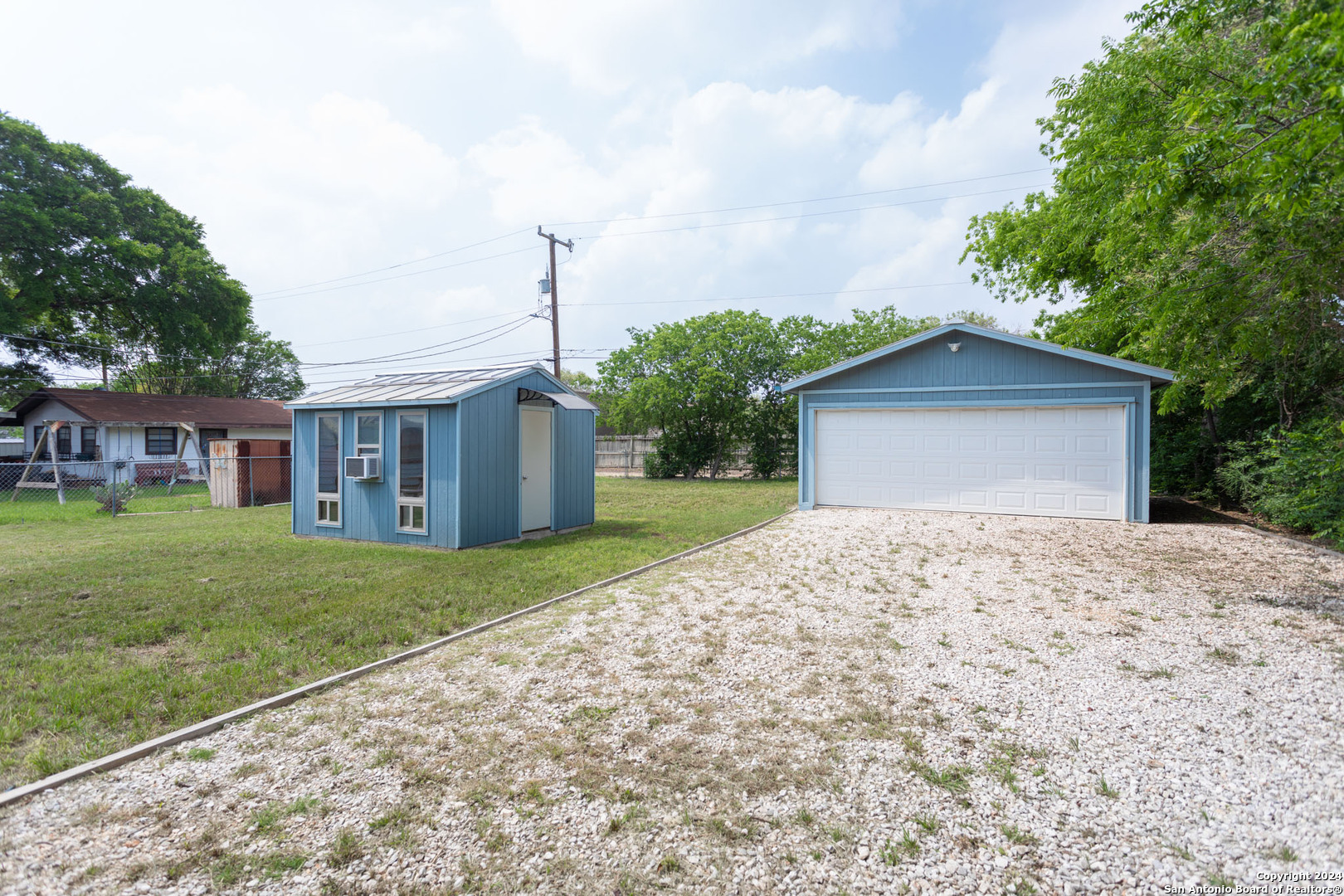 229 Weathercock Lane Windcrest, TX 78239 - Photo 11 of 12 a front view of a house with a garden and yard