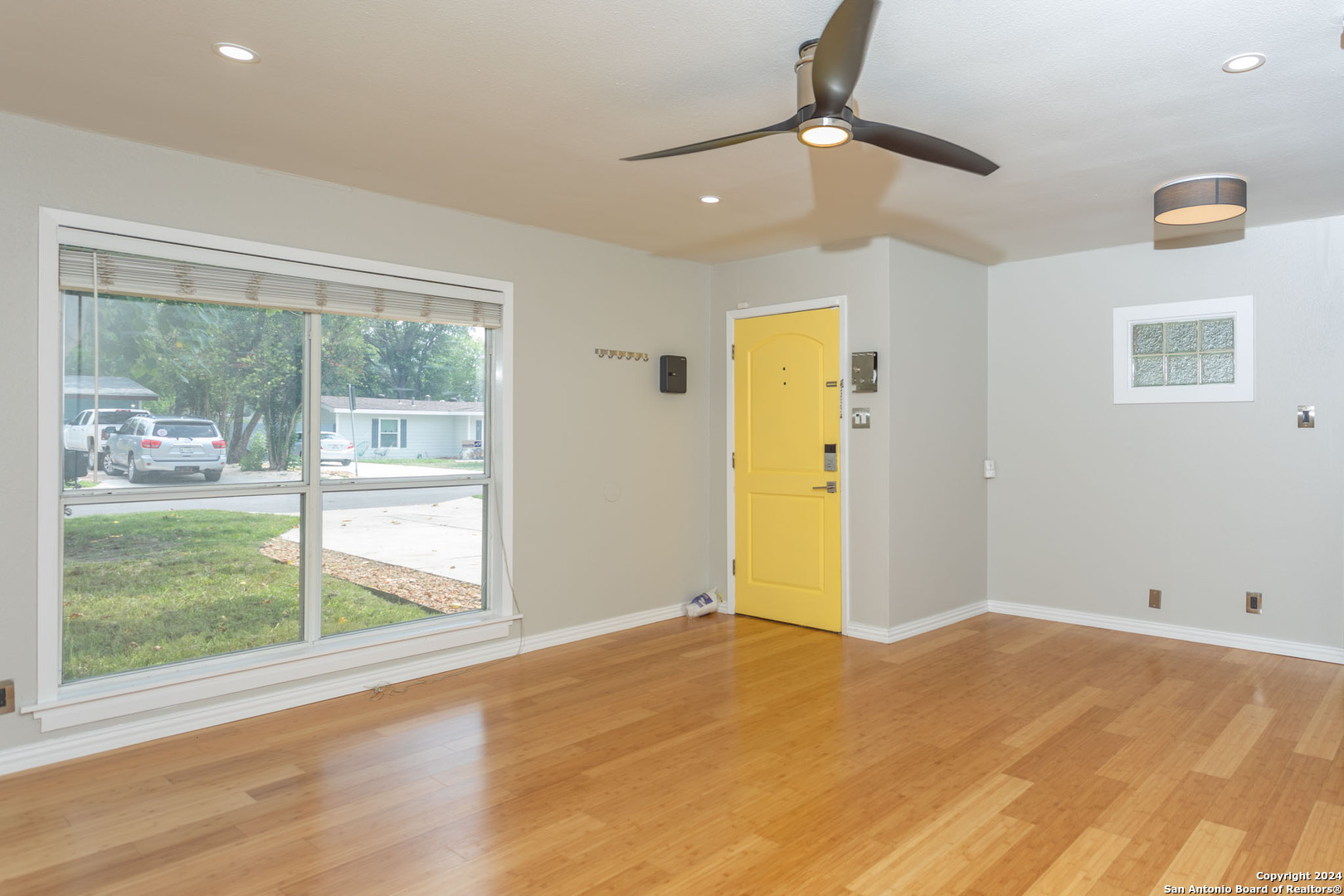 229 Weathercock Lane Windcrest, TX 78239 - Photo 2 of 12 a view of empty room with wooden floor and fan