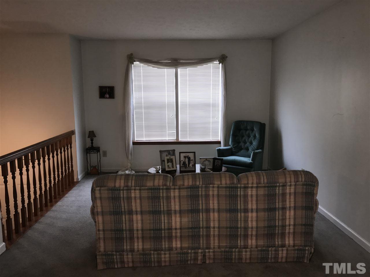 8205 Wynewood Drive Raleigh, NC 27616 - Photo 3 of 24 a dining room with furniture and a window