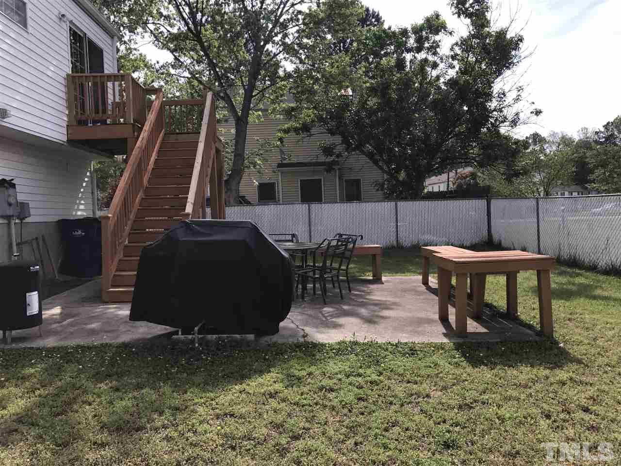 8205 Wynewood Drive Raleigh, NC 27616 - Photo 24 of 24 a view of a backyard with furniture and a slide