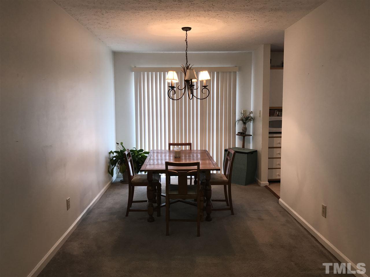 8205 Wynewood Drive Raleigh, NC 27616 - Photo 4 of 24 a dining room with furniture and window