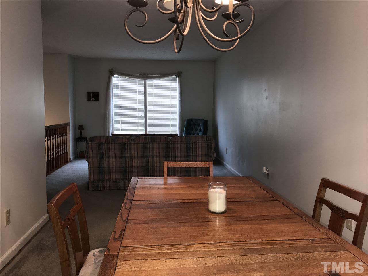 8205 Wynewood Drive Raleigh, NC 27616 - Photo 5 of 24 a view of a dining room with furniture