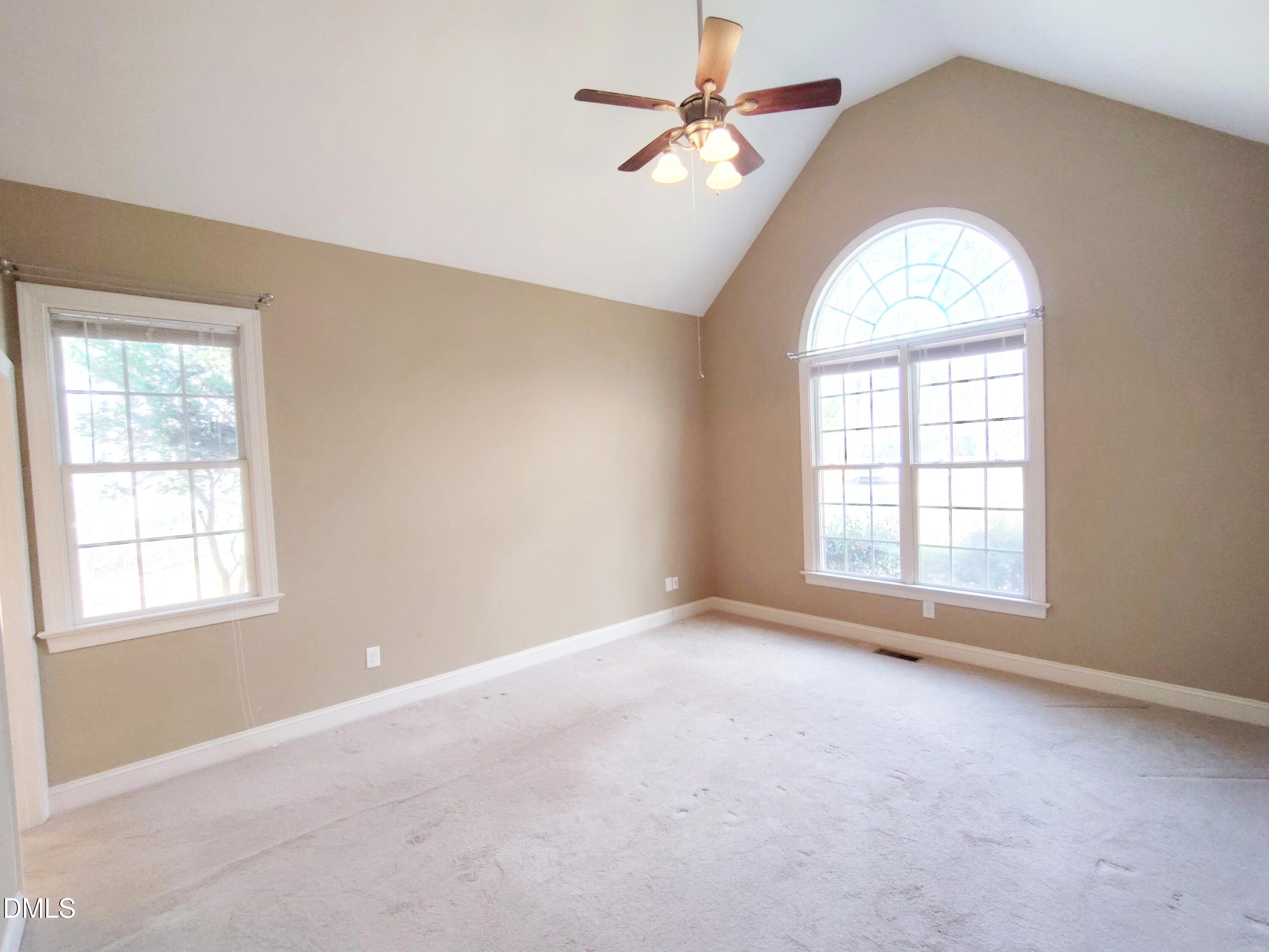 279 Weaver Ridge Road Rougemont, NC 27572 - Photo 11 of 25 an empty room with a window and a chandelier