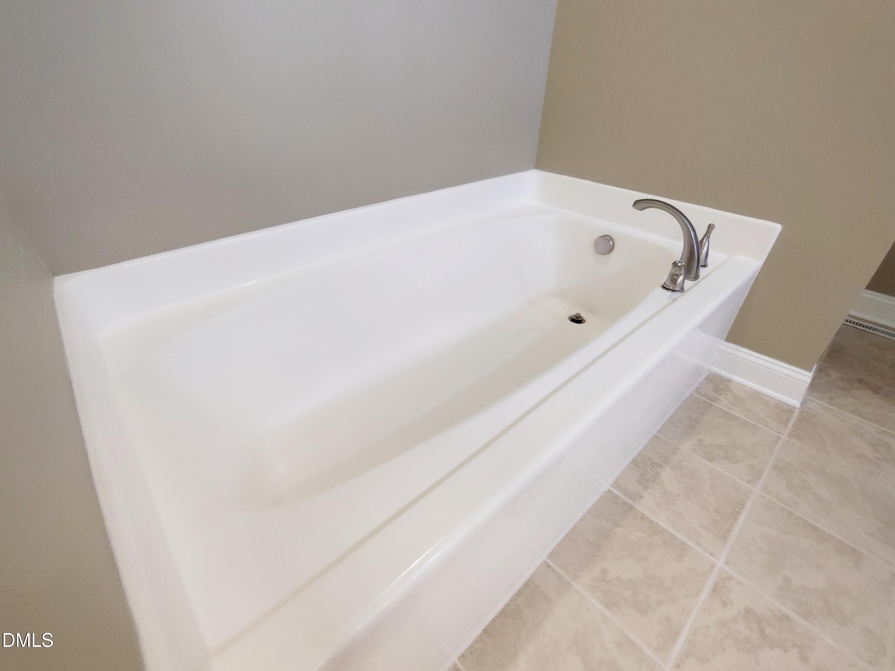 279 Weaver Ridge Road Rougemont, NC 27572 - Photo 14 of 25 a bath tub sitting in a bathroom
