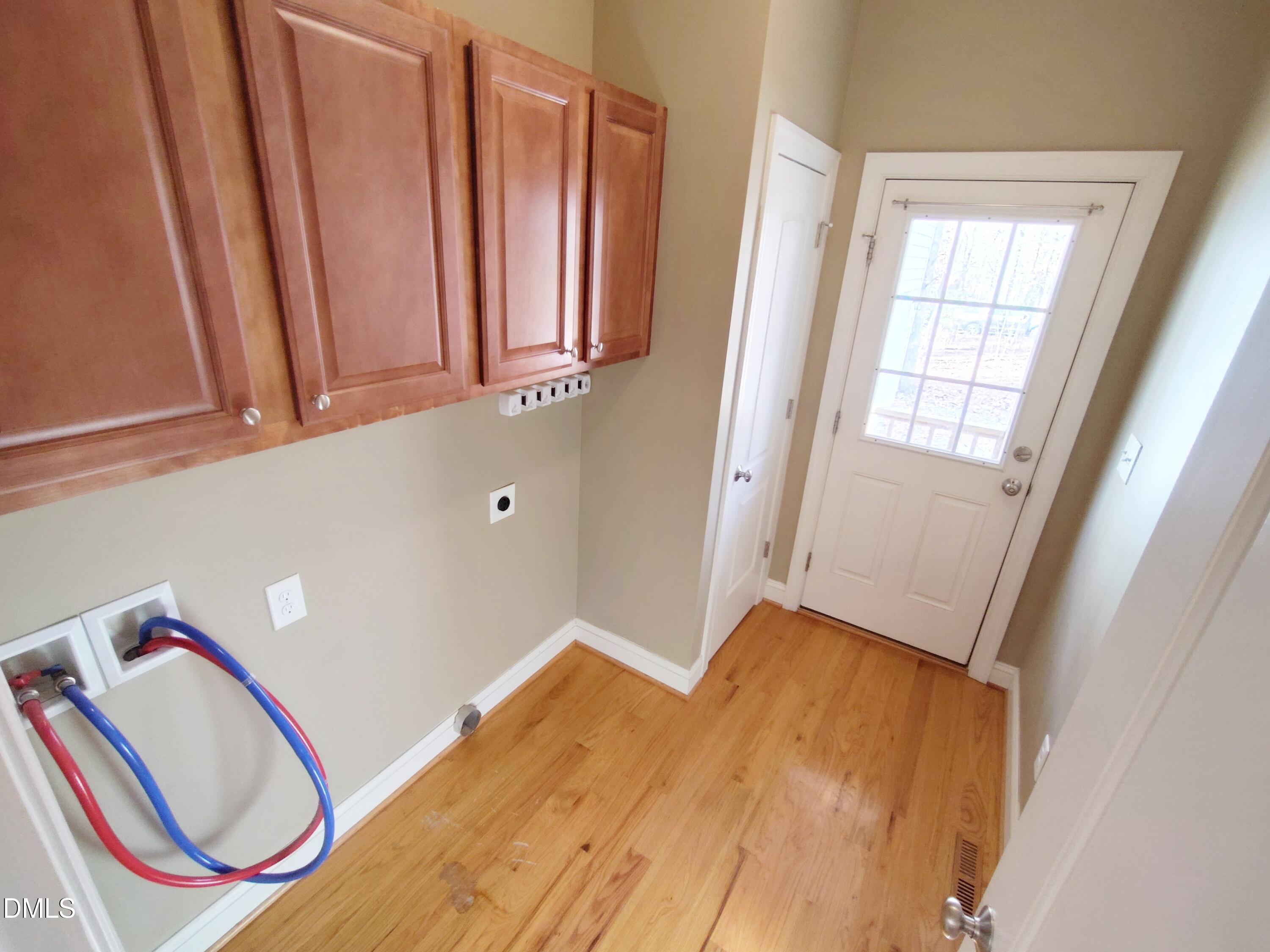 279 Weaver Ridge Road Rougemont, NC 27572 - Photo 21 of 25 a view of a hallway with washer and dryer
