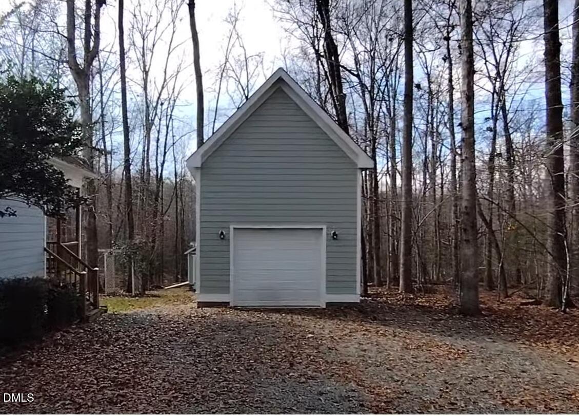 279 Weaver Ridge Road Rougemont, NC 27572 - Photo 25 of 25 a house with trees in front of it