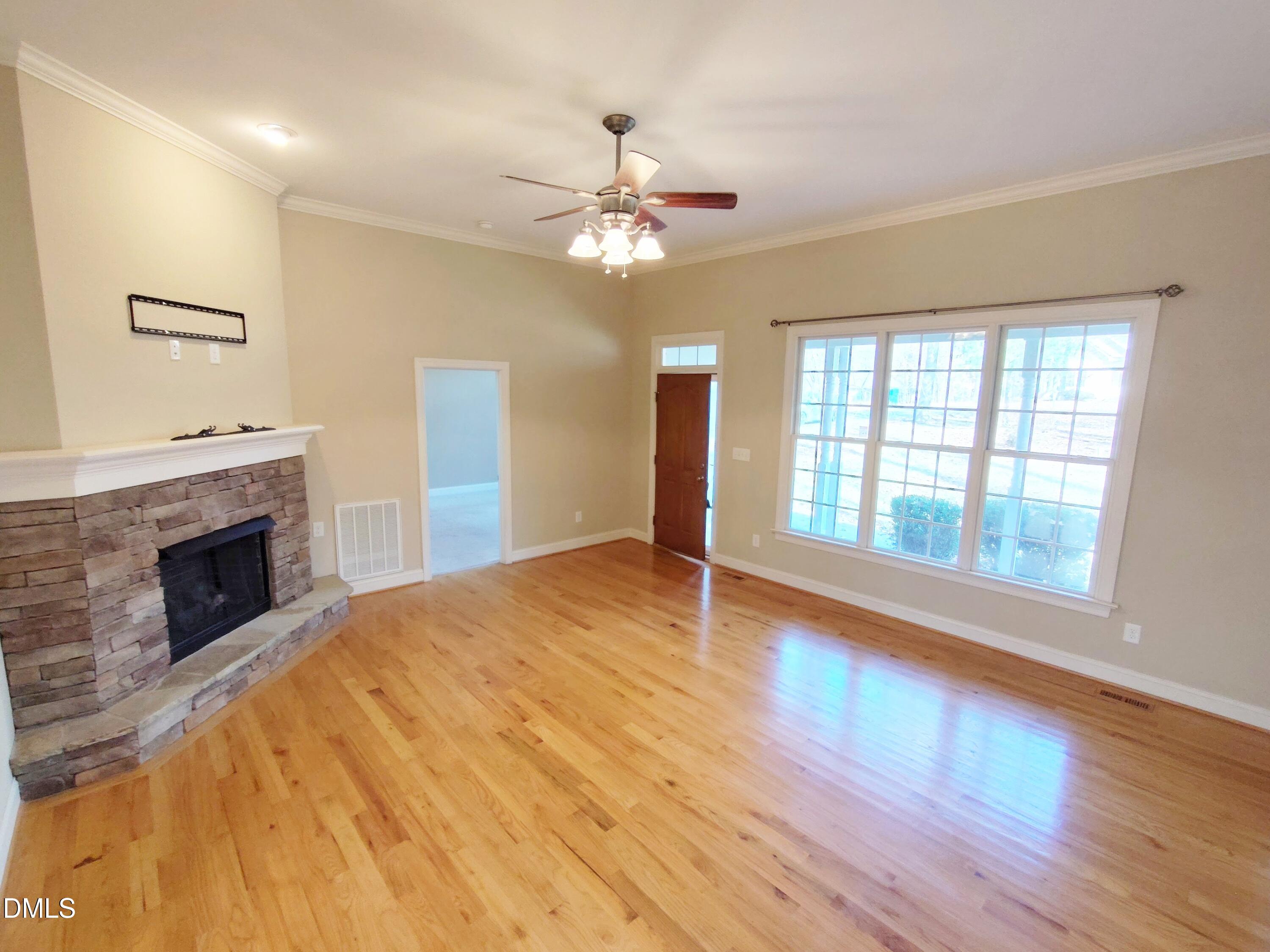279 Weaver Ridge Road Rougemont, NC 27572 - Photo 4 of 25 a view of an empty room with window and wooden floor