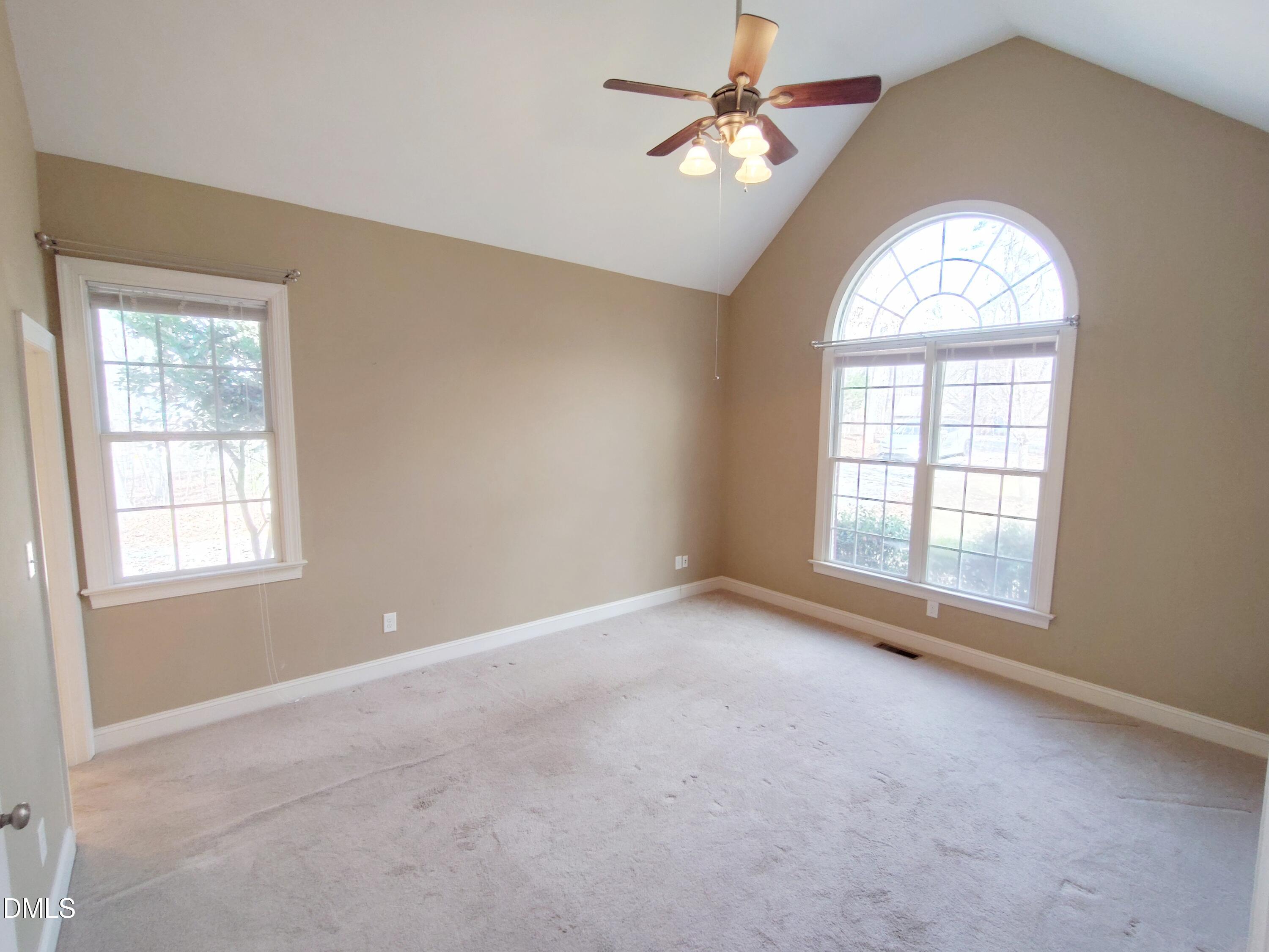 279 Weaver Ridge Road Rougemont, NC 27572 - Photo 10 of 25 an empty room with a window and a chandelier