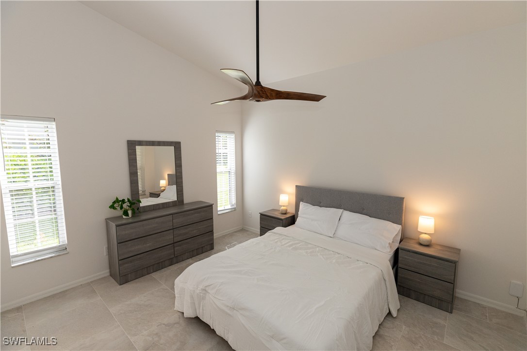 2170 Faliron Road North Fort Myers, FL 33917 - Photo 12 of 30 a bedroom with a bed and window