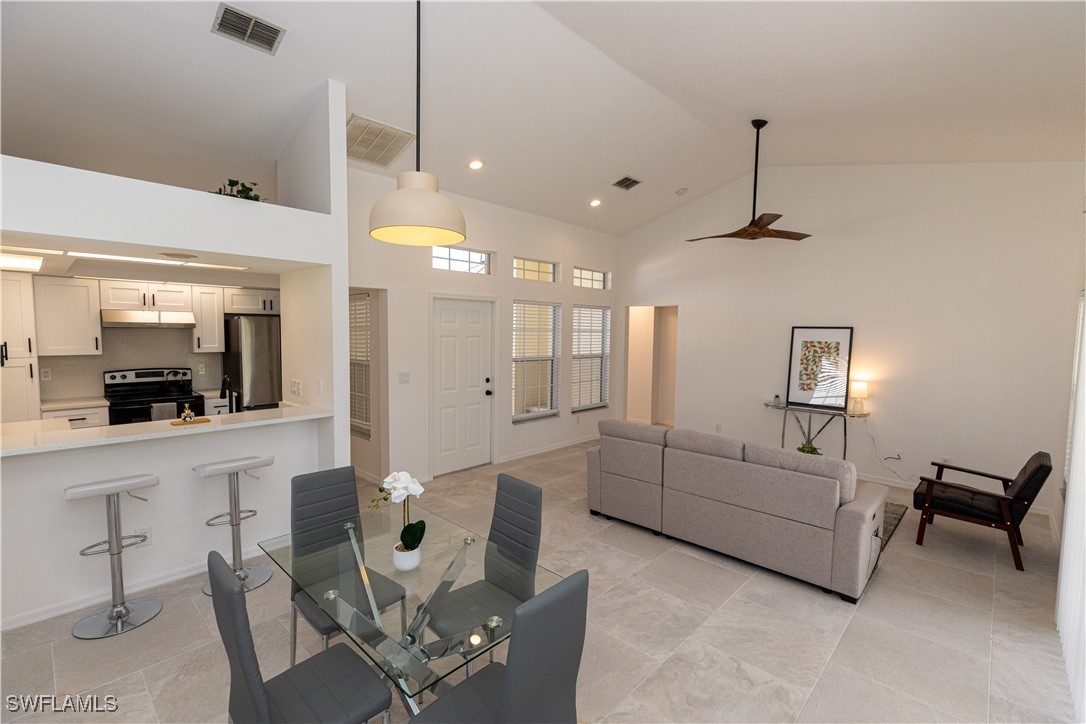 2170 Faliron Road North Fort Myers, FL 33917 - Photo 7 of 30 a living room with furniture and a chandelier