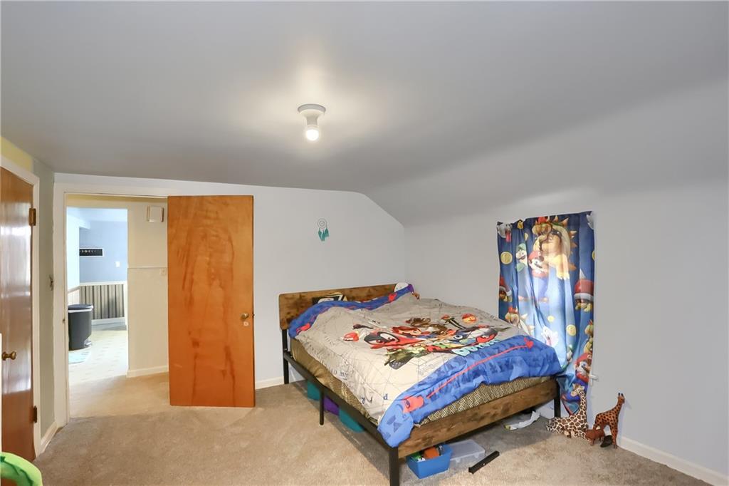 3564 Ellwood Road New Castle, PA 16101 - Photo 13 of 34 a bedroom with a bed and a table
