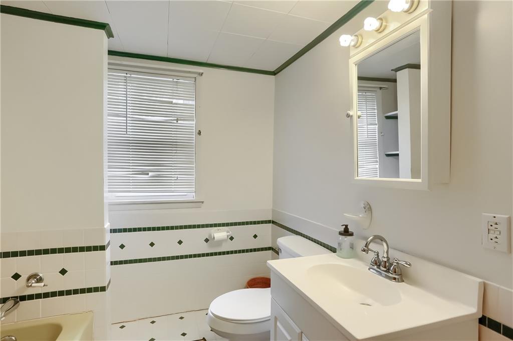 3564 Ellwood Road New Castle, PA 16101 - Photo 18 of 34 a bathroom with a sink a toilet and vanity